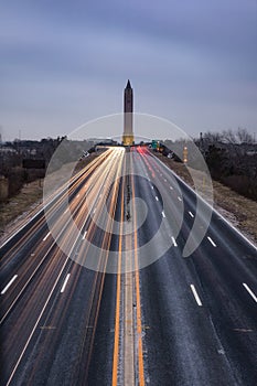 Light trails from traffic on the Wantagh State Parkway leading to the Jones Beach water tower.