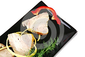 Light tuna slices served on plate