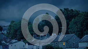 Light Turned On In Row Of Houses At Dusk