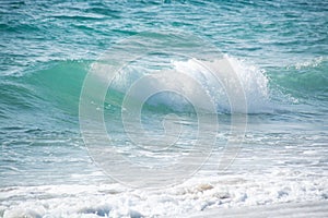 Light turquoise blue wave of the Mediterranean Sea