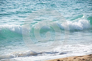 Light turquoise blue wave of the Mediterranean Sea