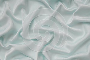 Light turquoise satin material, blue sateen fabric, silk textil photo