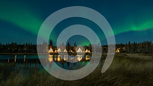 Light up Tipi indian Tent with water reflection during Aurora