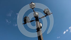 Light vintage Post With Blue Sky Background. Street lamp outdoor