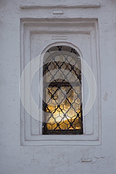Light in a window of strary Christian church