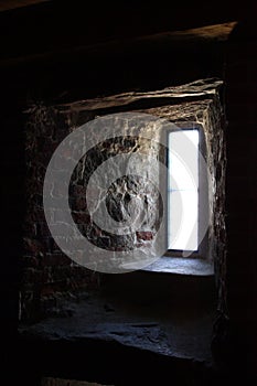 Light from window in thick stone wall