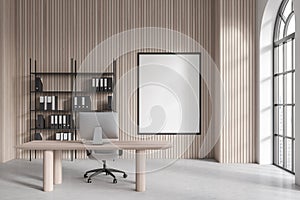 Light wooden CEO office with poster