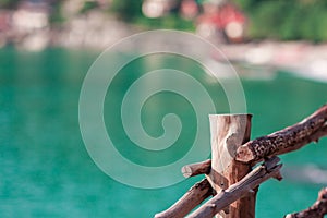 Light wooden fence with the blurred sea backdrop background with copy space