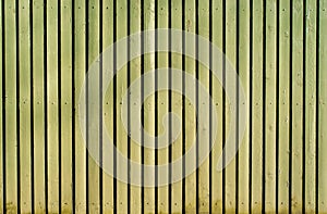 Light yellow old wooden painted fence