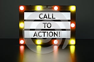 Lightbox with red and orange lights in dark room with words - call to action