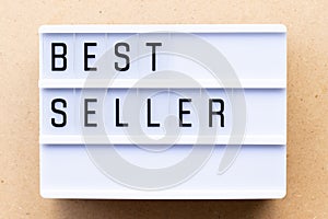 Lightbox with best seller word on wood background