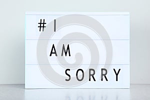 Lightbox with words I Am Sorry