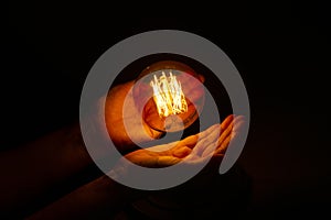 Lightbulb on hand ,abstract enegy magic concept