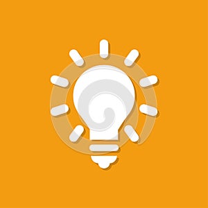 Lightbulb icon with shadow in a flat design on a orange background