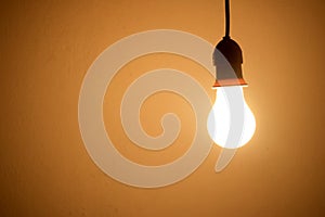 Lightbulb Lamp orange light in room at night