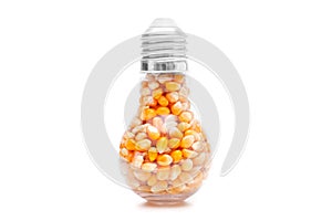 Lightbulb with popcorn seeds on white