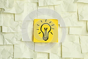 Lightbulb on sticky notes photo