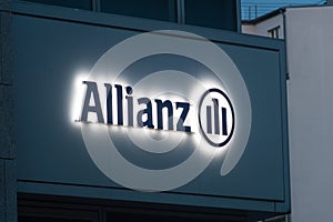 Lighted Allianz logo and sign in Berlin. Allianz is a European financial services company headquartered in Munich, Germany.