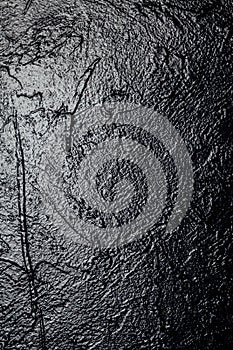 Lighted black textured wall as a background