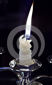 Lighted candle that lights up the dark