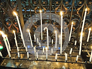 Lighted candles on altar of cathedral