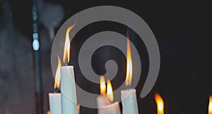 Lighted candles in the chapel of Lourdes