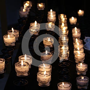 Lighted candles in a church