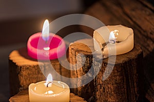 Lighted candles with ornate wood and scented and energetic incense