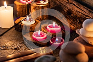 Lighted candles with ornate wood and scented and energetic incense