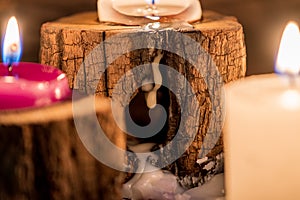 Lighted candles with ornate wood and scented and energetic incense photo