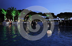 Lighted Candles on Pool, Dinner Party, Dusk Scene photo