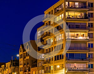 Lighted city apartments and buildings by night, Blankenberge, Belgium