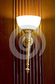 Lighted classic sconce on the wall