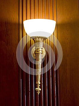 Lighted classic sconce on the wall