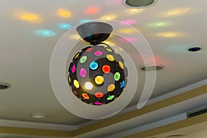 Lighted disco ball on a celling 