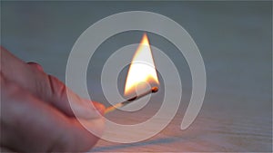 A lighted match is burning