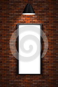 Lighted picture frame on a red brick wall