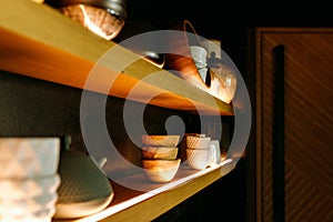 Lighted shelf in a restaurant with traditional Chinese dishes