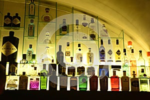 Gin Bottles on Lighted Shelves, Business, Fashion Beverages