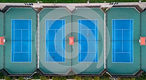 Lighted tennis courts grouped together