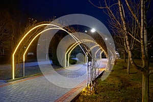 Lighted walkway in a night park