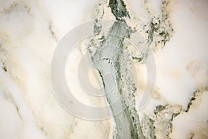 Lightened slices marble onyx. Horizontal image. Warm green colors. Beautiful close up background
