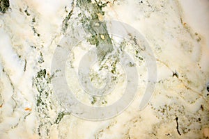 Lightened slices marble onyx. Horizontal image. Warm green colors. Beautiful close up background