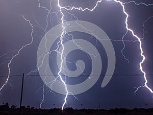 Lightening strikes in night sky