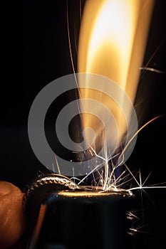 A Lighter Being Lit in the Dark