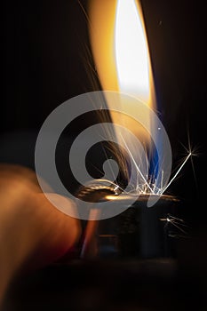 A Lighter Being Lit in the Dark