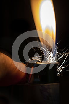 A Lighter Being Lit in the Dark