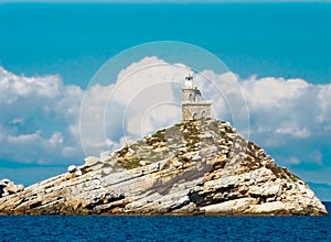 Lighthous on a white rock in Elba