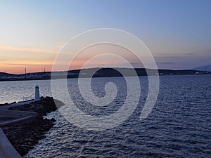 Lighthouse of Aliaga Izmir with still sea photo