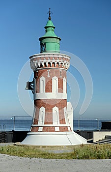 Lighthouse on the background of the sea